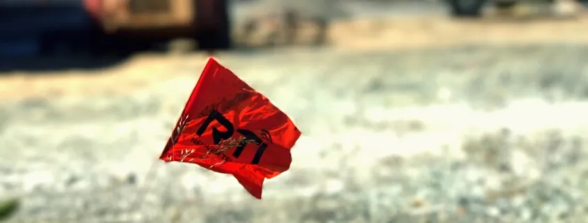 Red flag with black letters outdoors